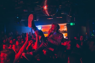 Crowd enjoying a live underground rock concert at San Nicasio Distrito Rock venue.