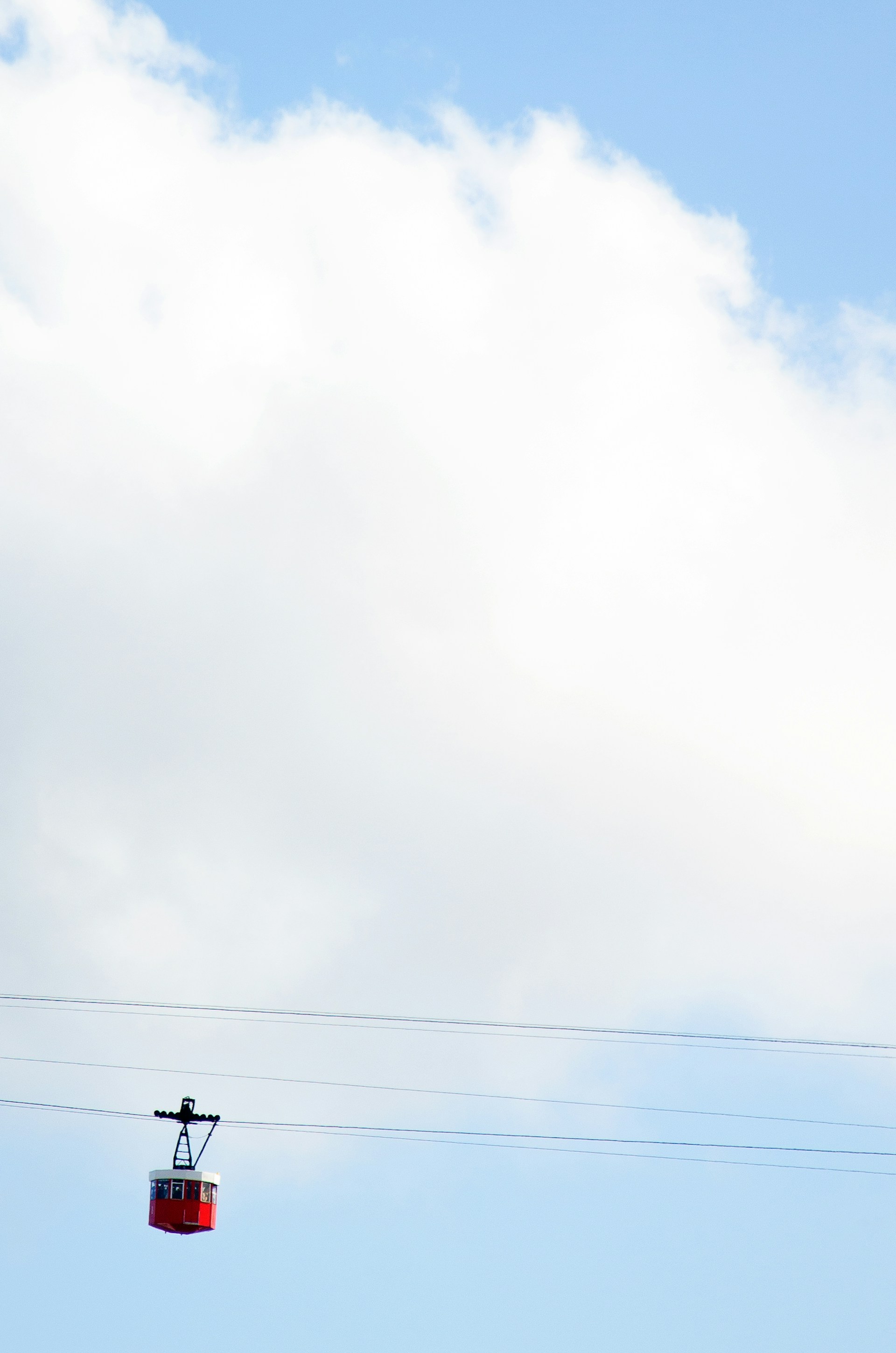 woman wearing yellow long-sleeved dress under white clouds and blue sky during daytime