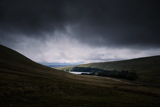 brown mountain under cumulos clouds in Brecon Beacons United Kingdom