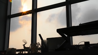 A serene workspace with muted blue accents and soft natural light filtering through a window.