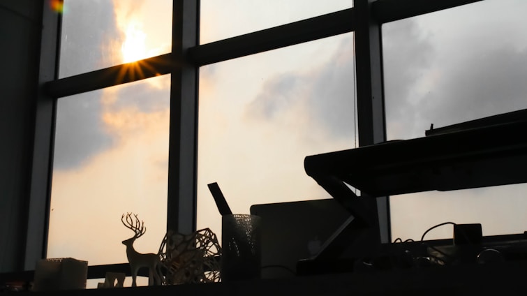A serene workspace with muted blue accents and soft natural light filtering through a window.