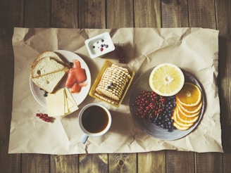 bread and fruits on plate