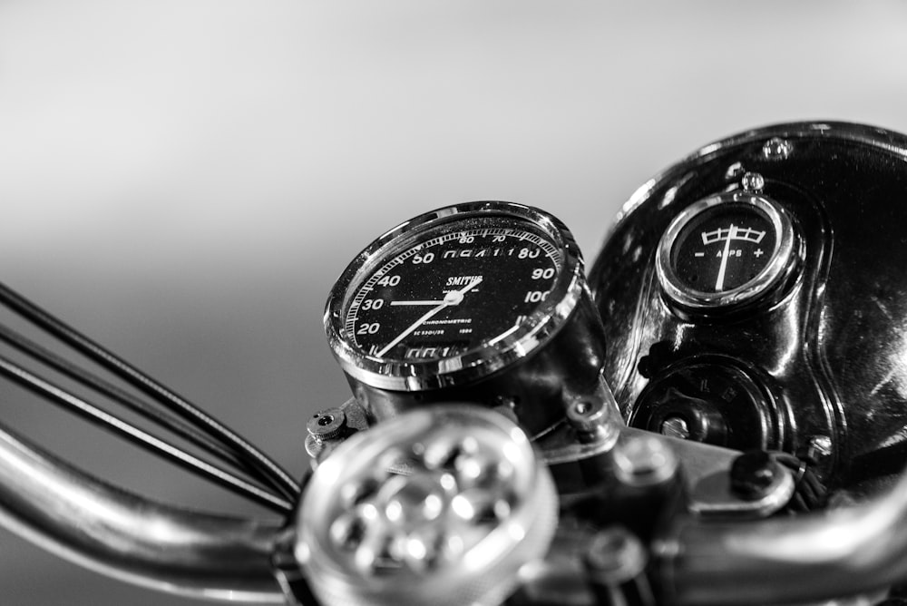 greyscale photography of motorcycle speedometer