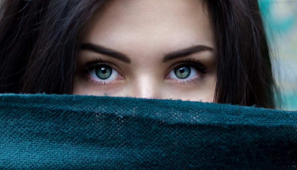 a close up of a person with blue eyes