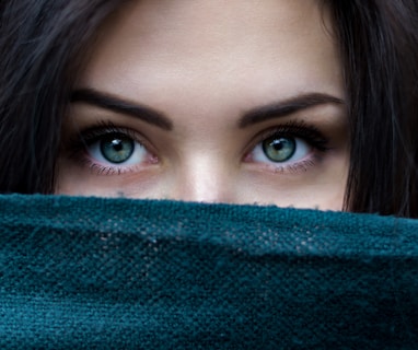 a close up of a person with blue eyes