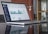 laptop computer on glass-top table
