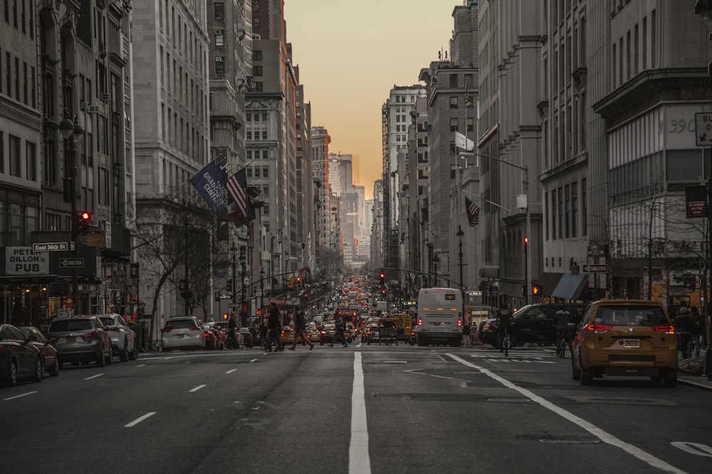 car lot in a road near buildings during daytime