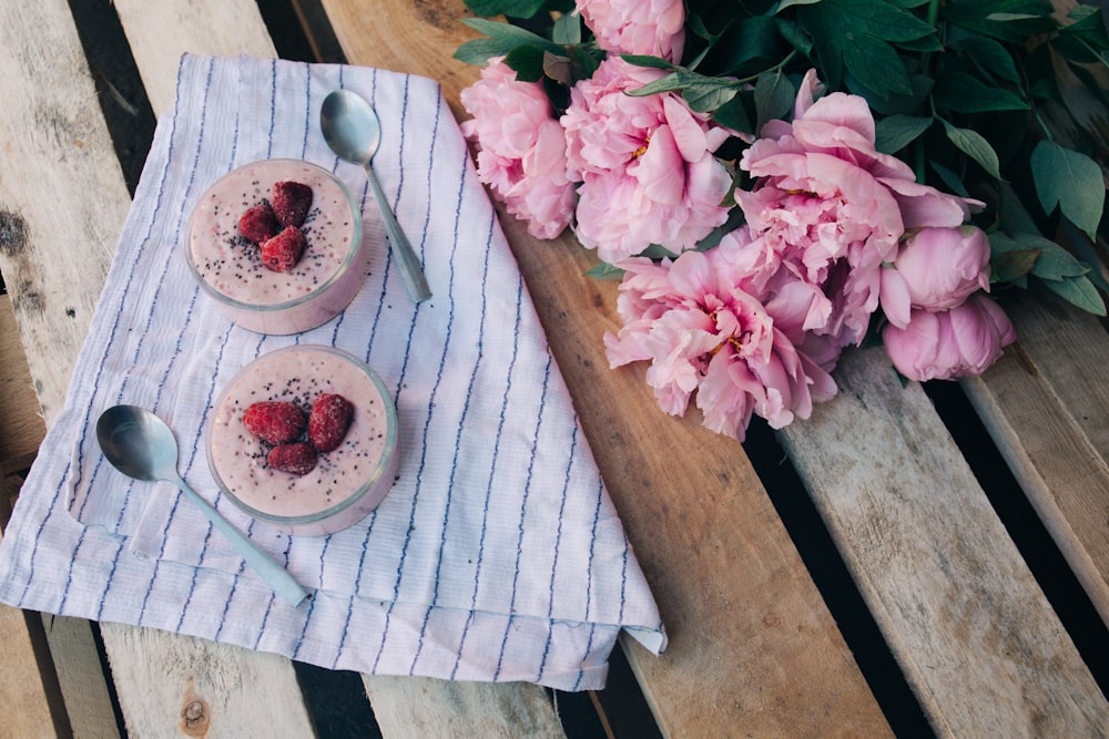 two cupcakes on brown wooden pallet