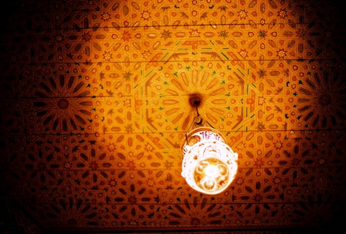 A beautifully crafted gypsum ceiling with intricate patterns and soft lighting.