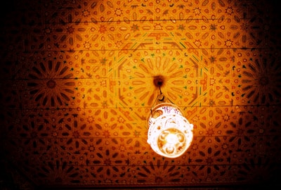 A beautifully decorated ceiling with intricate gypsum patterns and soft lighting.