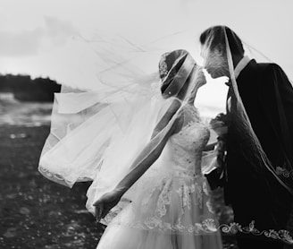 grayscale shot of bride and groom