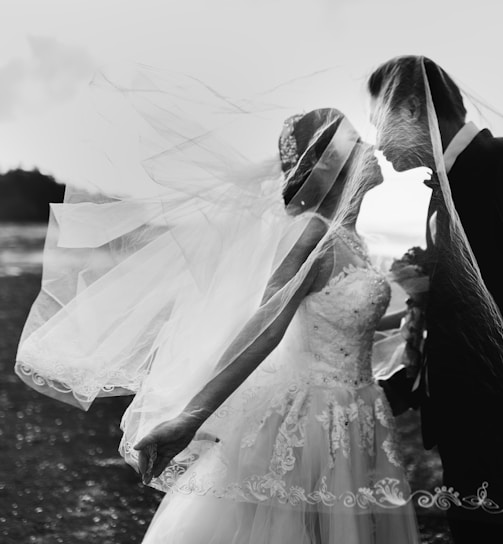 grayscale shot of bride and groom