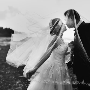 grayscale shot of bride and groom