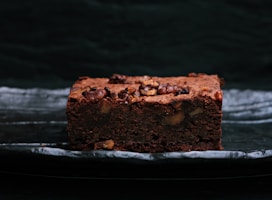 sliced baked brownies on foiled tray