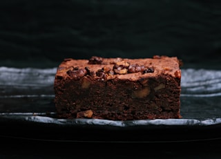 sliced baked brownies on foiled tray