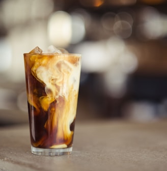 glass cup filled with ice latte on tabletop