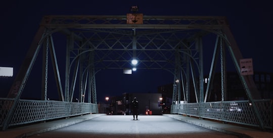 silhouette of man on bridge in Saint-Henri Canada