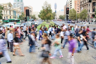 timelapse photo of people passing the street