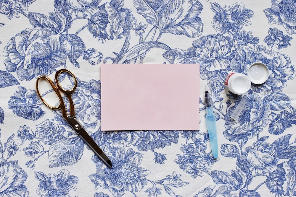 a pair of scissors sitting on top of a table