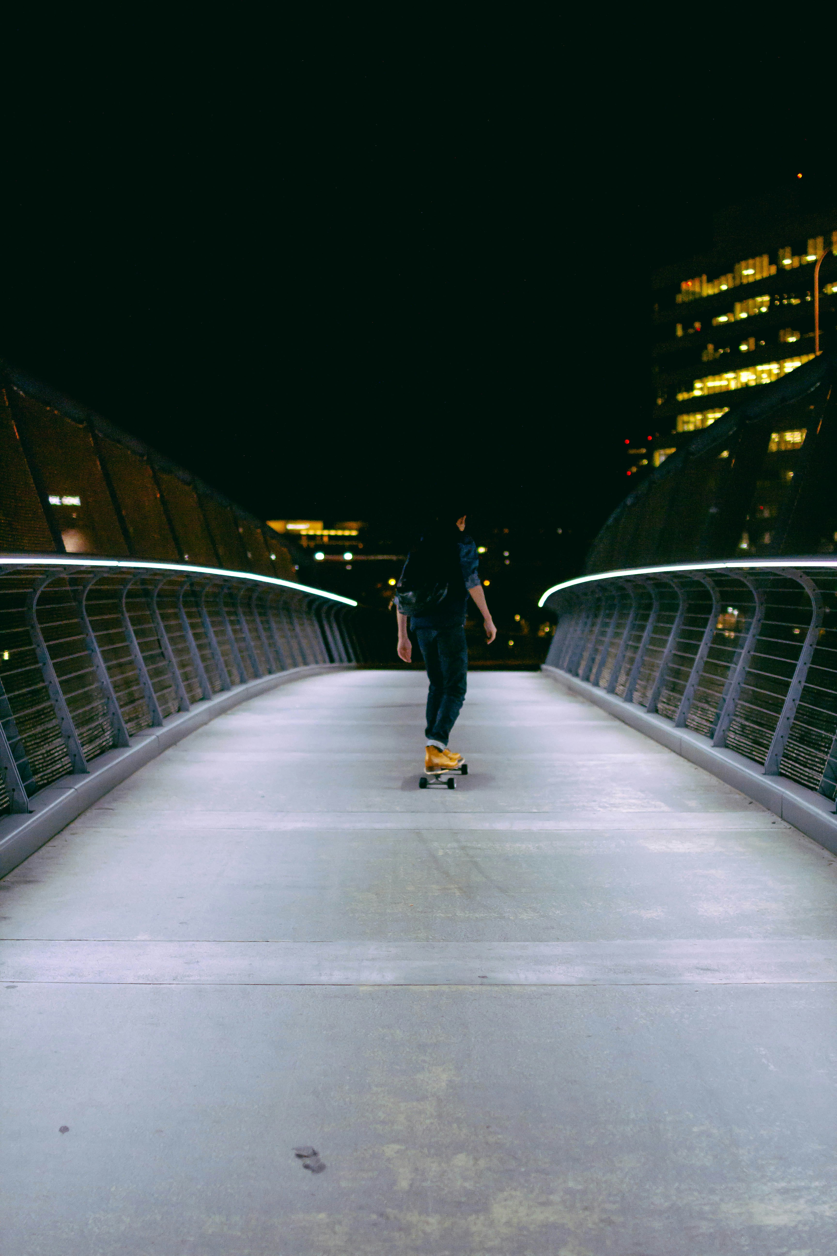 man skating on gray concrete road