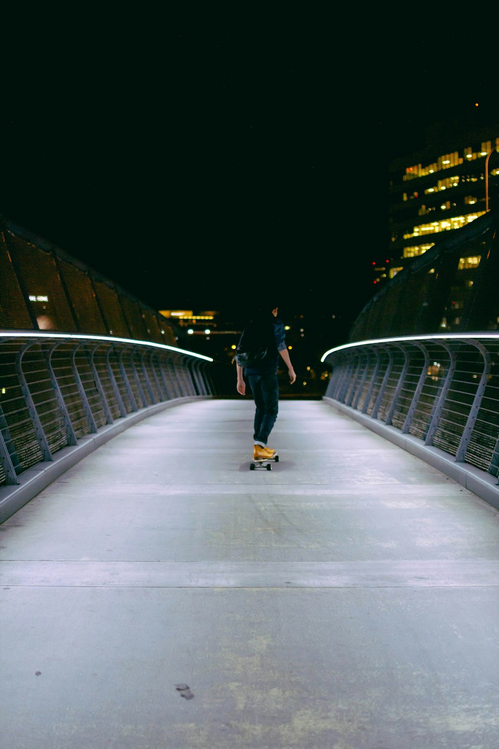 man skating on gray concrete road