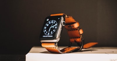black smartwatch on box apple watch zoom background