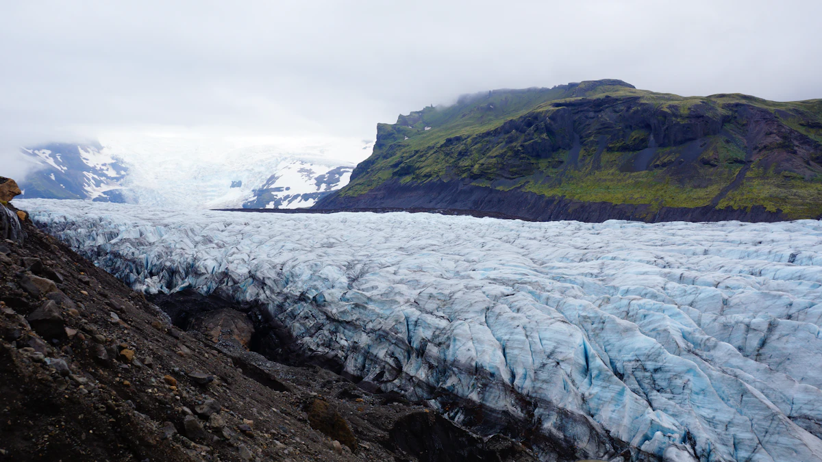 Snow-streaked mountains and tidewater ice in Glacier Bay, Alaska