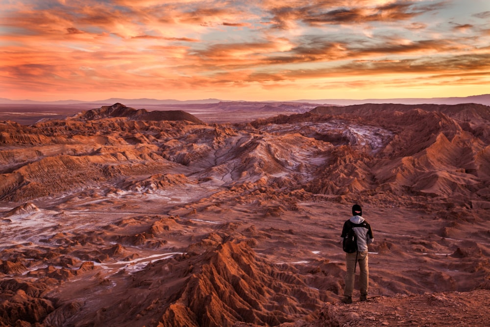 man standing near mountains