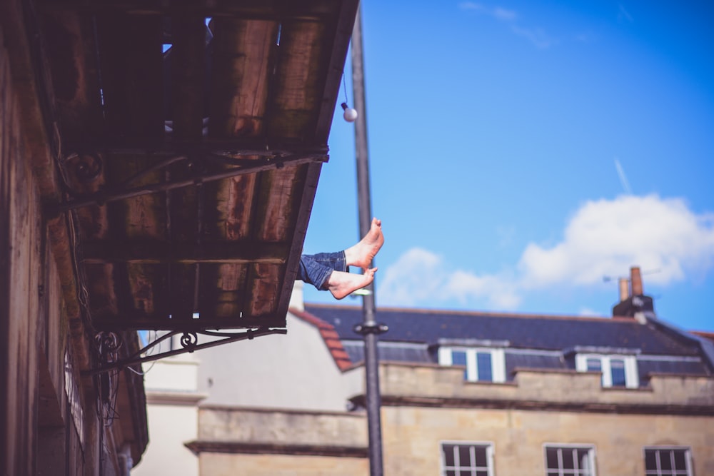 person feet on the roof