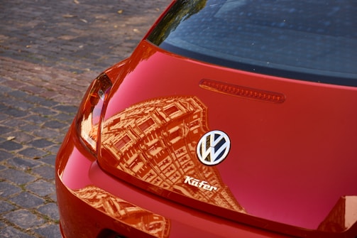 Close-up of a shiny red Volkswagen Fusca, a beloved Brazilian classic.