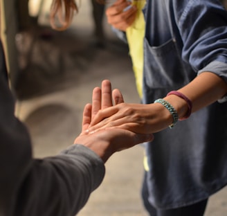 man and woman holding hands on street