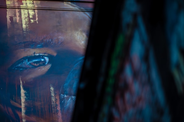 Close-up of a detailed manga-inspired print showing intricate line work and expressive eyes.