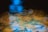 Underwater view showing fish swimming among aquatic plants and sandy substrate, with a reflection of blue light on the water surface.