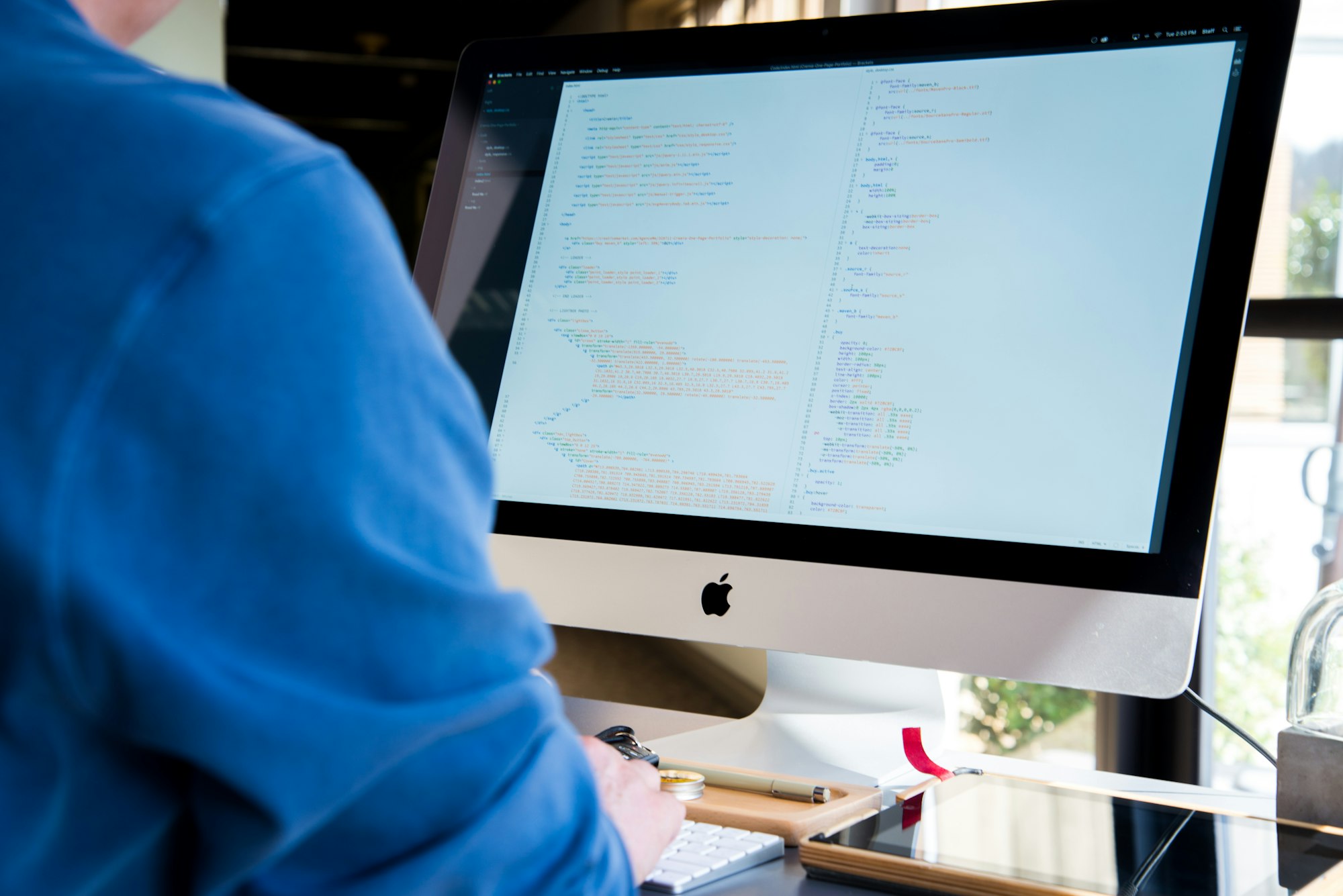 Developer working on an iMac