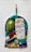 A pendant featuring a variety of gemstones in different shapes and colors, including a large green oval stone, a rectangular crystal with a frosted texture, and several round pearls. The stones are arranged in a metal frame with a hook at the top.