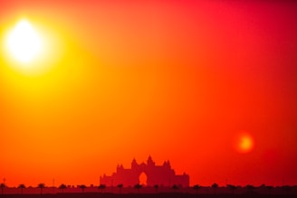 An evocative sunset behind the Jamaican parliament building, symbolizing change and hope.