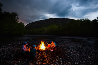 Footloosearther team sharing a campfire story during a remote mountain trek.