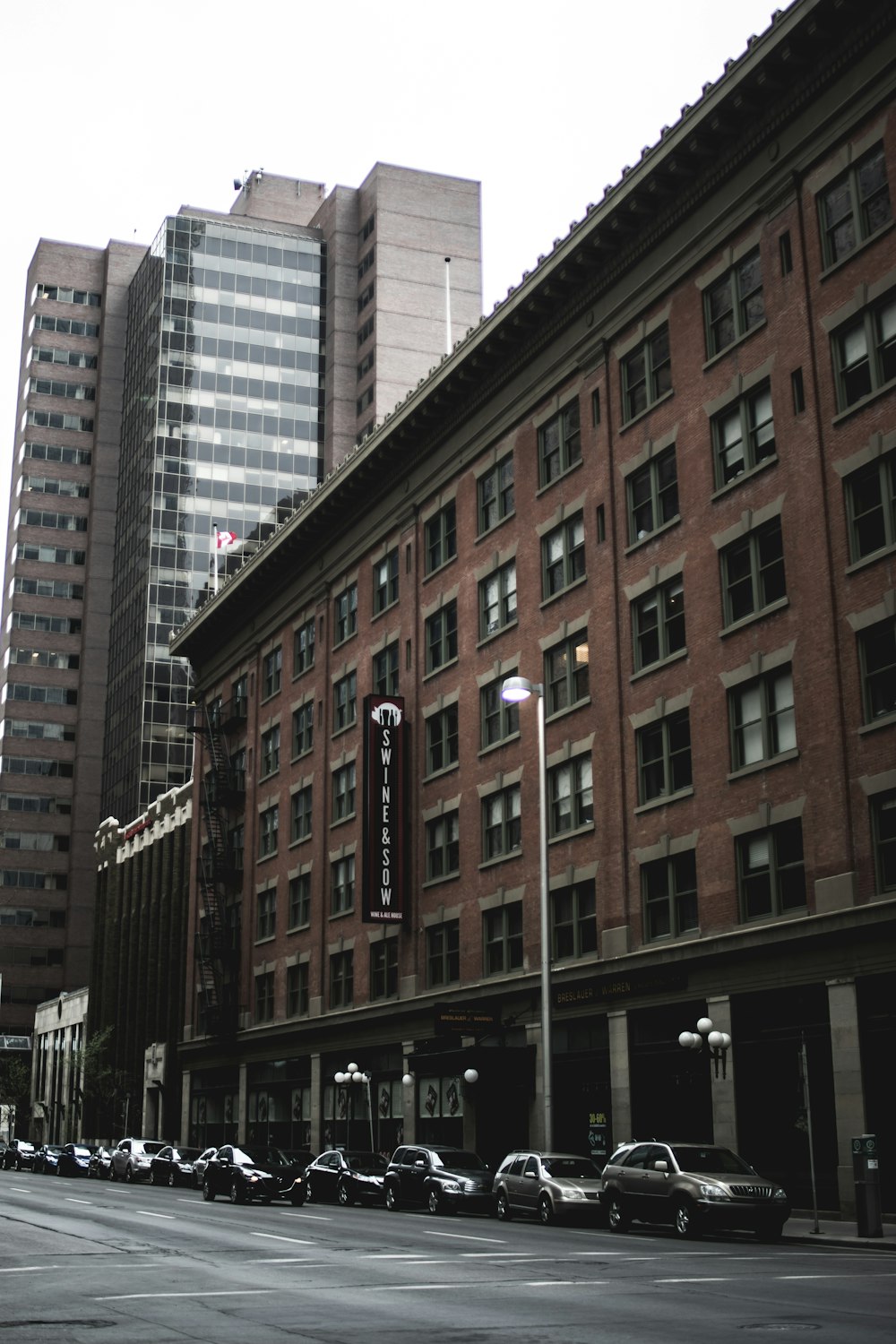 vehicles park beside brown concrete building