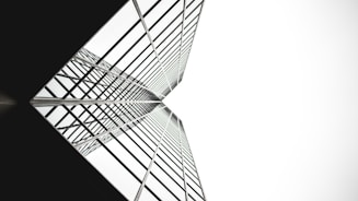 low angle photo of mirror glass building