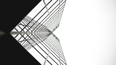 low angle photo of mirror glass building