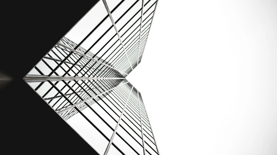 low angle photo of mirror glass building