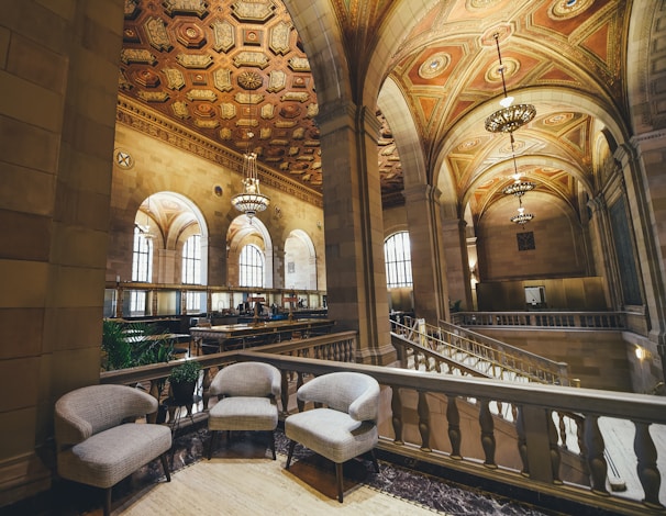 three fabric chairs near balustrade