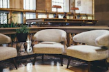 Inviting seating area with plush chairs and a small coffee table in a guest room.