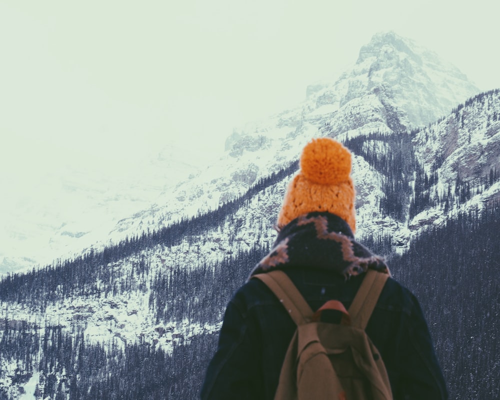 person standing on mountain during daytime