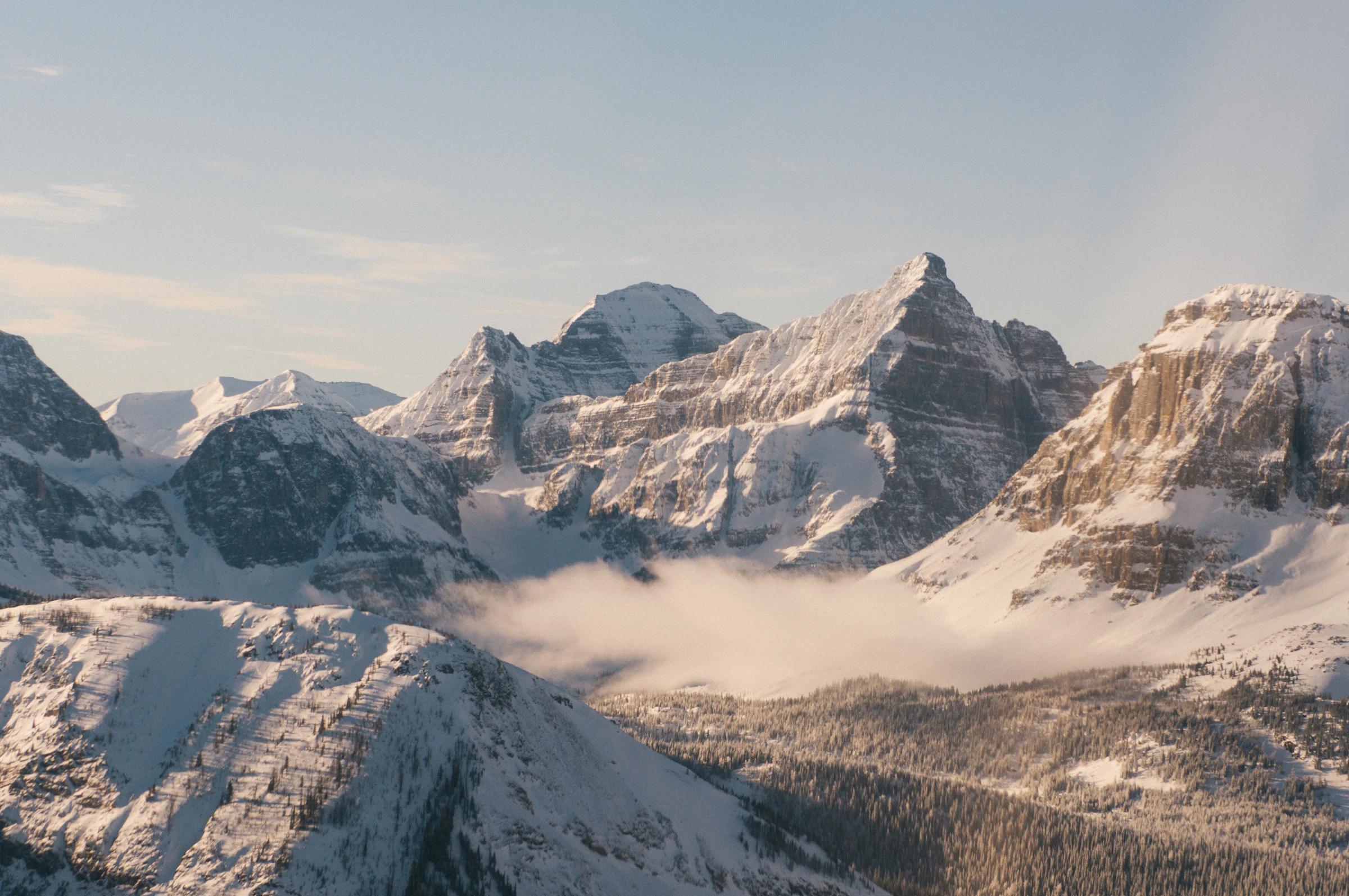 A snow-covered Canadian mountain slope under an open sky