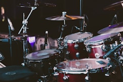 selective focus photography of red drum set