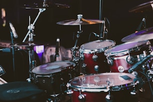 selective focus photography of red drum set