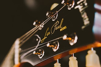 black and brown Gibson Les Paul guitar head stock