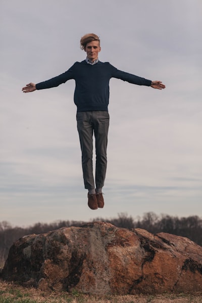 a man flying above ground