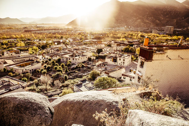 A serene mountain village in Hunza Valley bathed in golden sunset light, showcasing traditional architecture and vibrant culture.